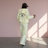 Person wearing a  hoodie and pants with 'Bonnefete Club' text, standing against a plain background.