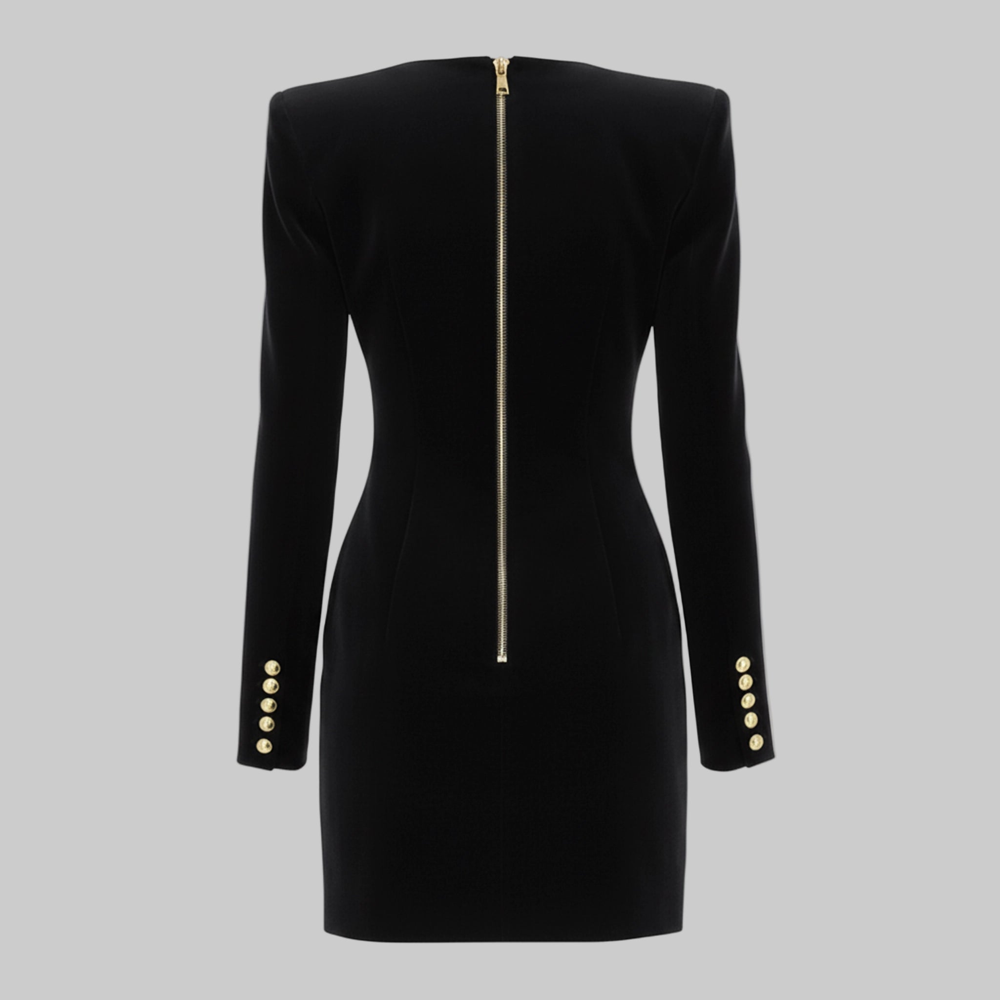 Black dress with gold buttons and zipper on a gray background