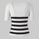 White ribbed knit top with black and white striped pattern on a white background