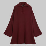 Maroon sweater dress on a white background