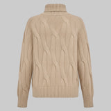 Beige cable knit sweater on a light gray background