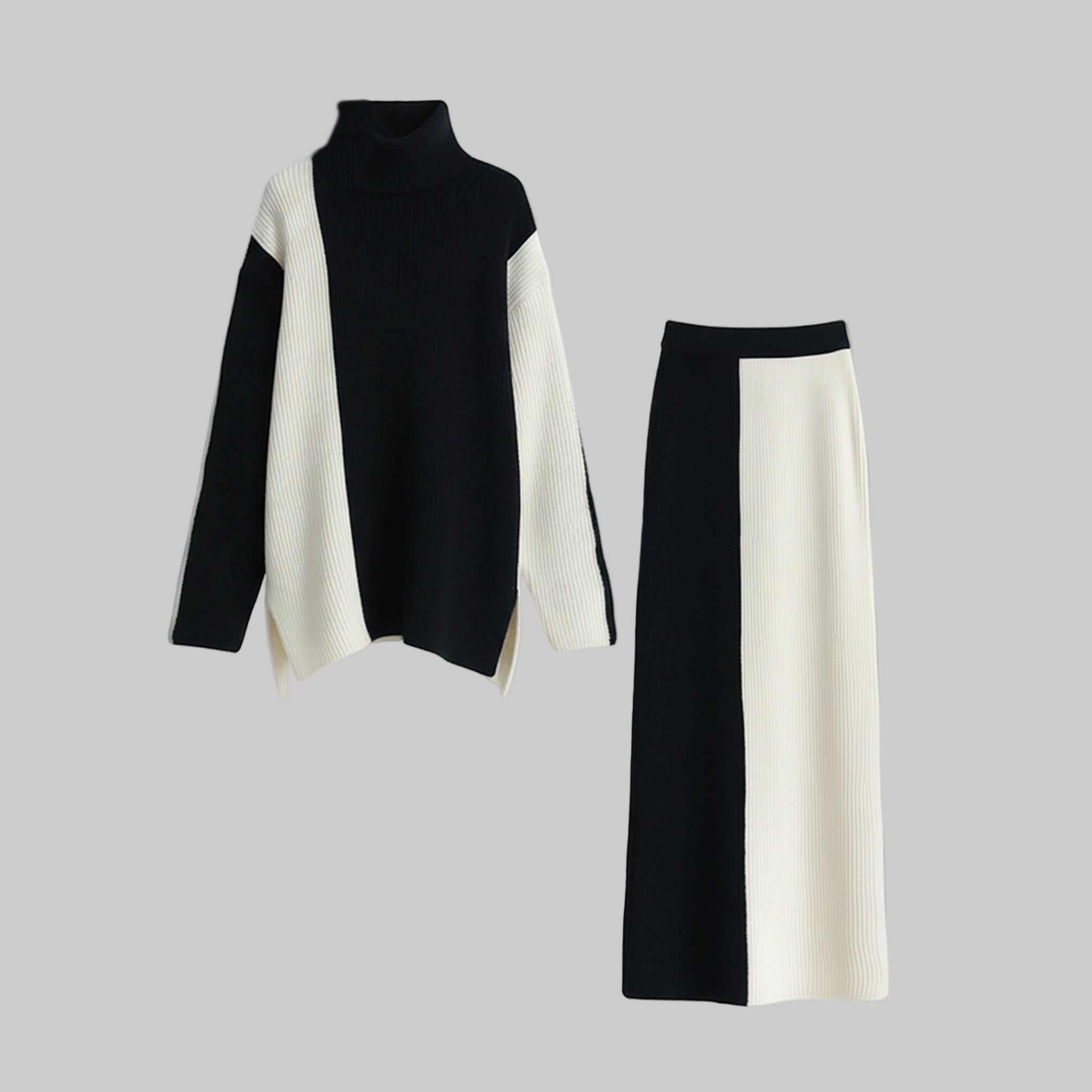 Black and white turtleneck sweater and skirt set on a gray background