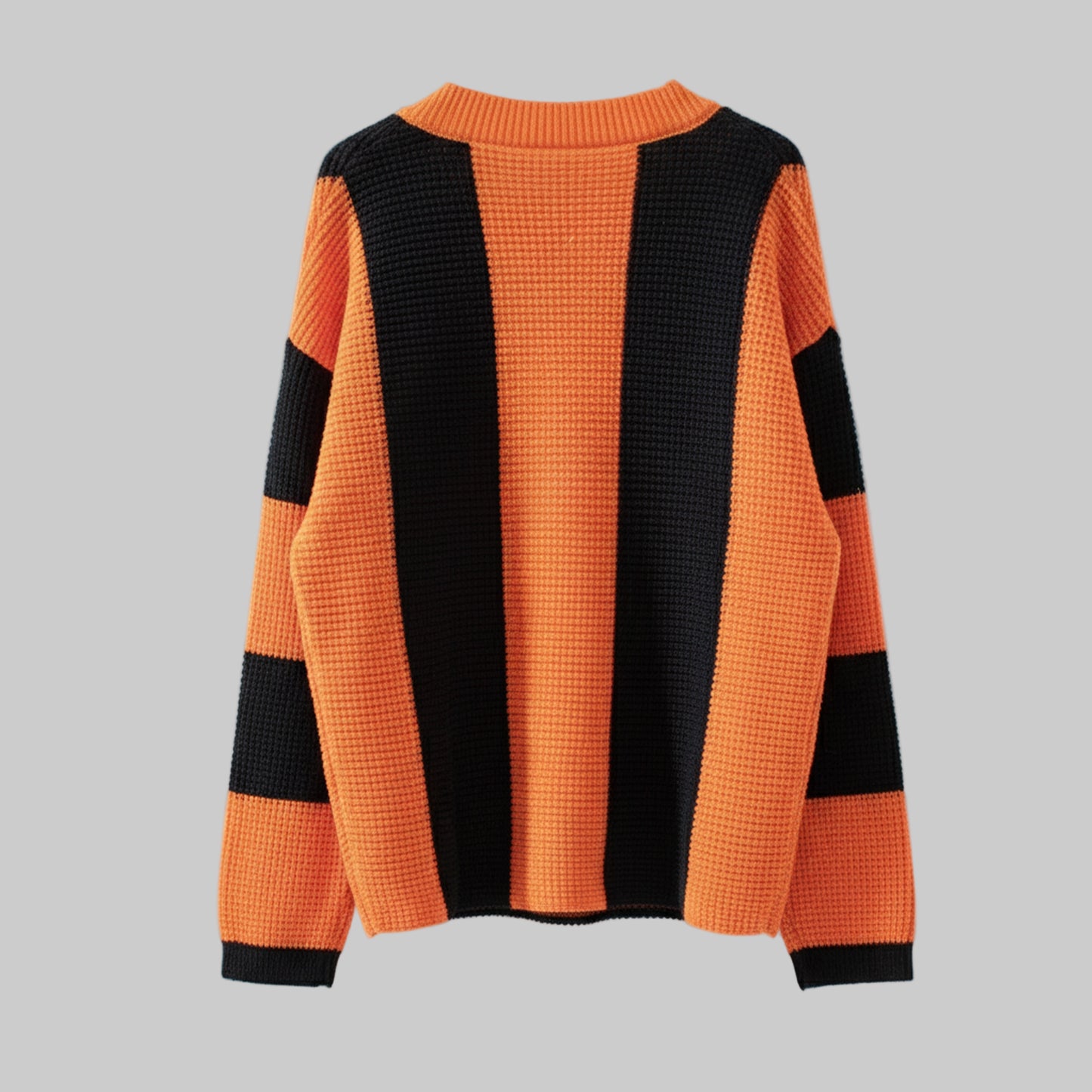 Orange and black striped sweater on a white background