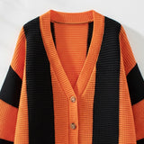 Black and orange striped cardigan on a white background
