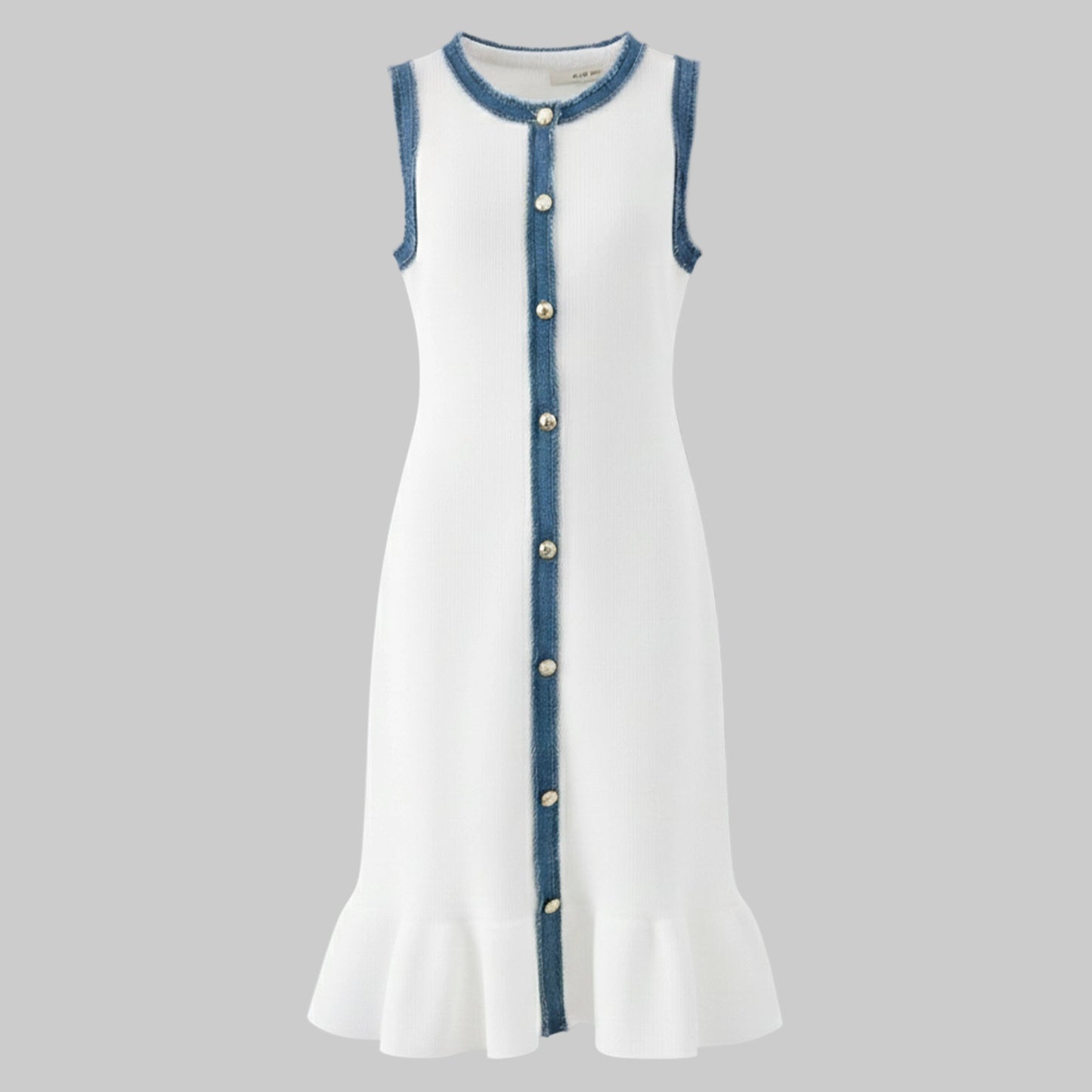 White dress with blue trim and buttons on a gray background