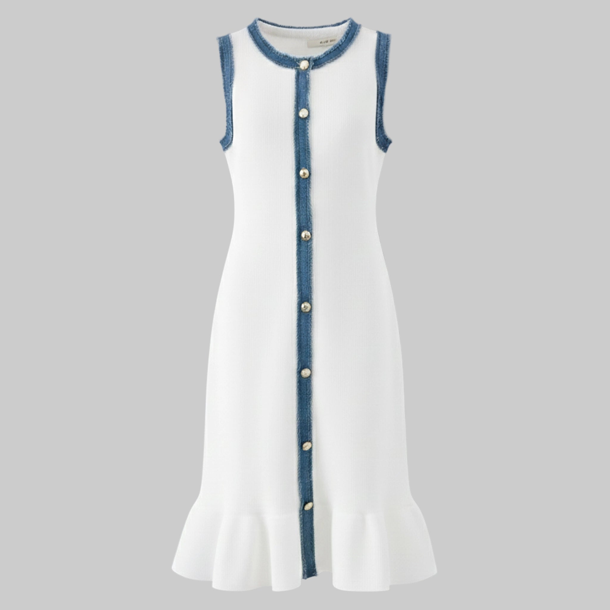 White dress with blue trim and buttons on a gray background