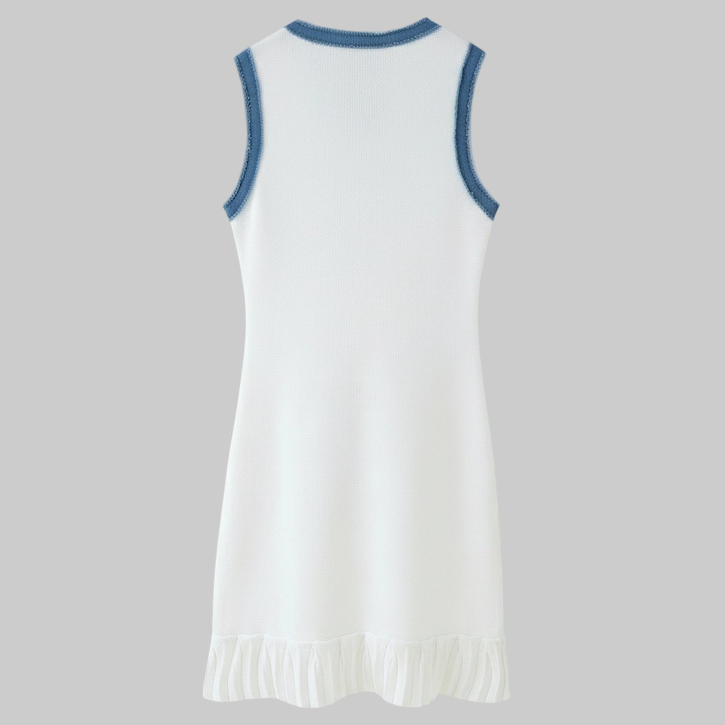 White dress with blue trim on a gray background