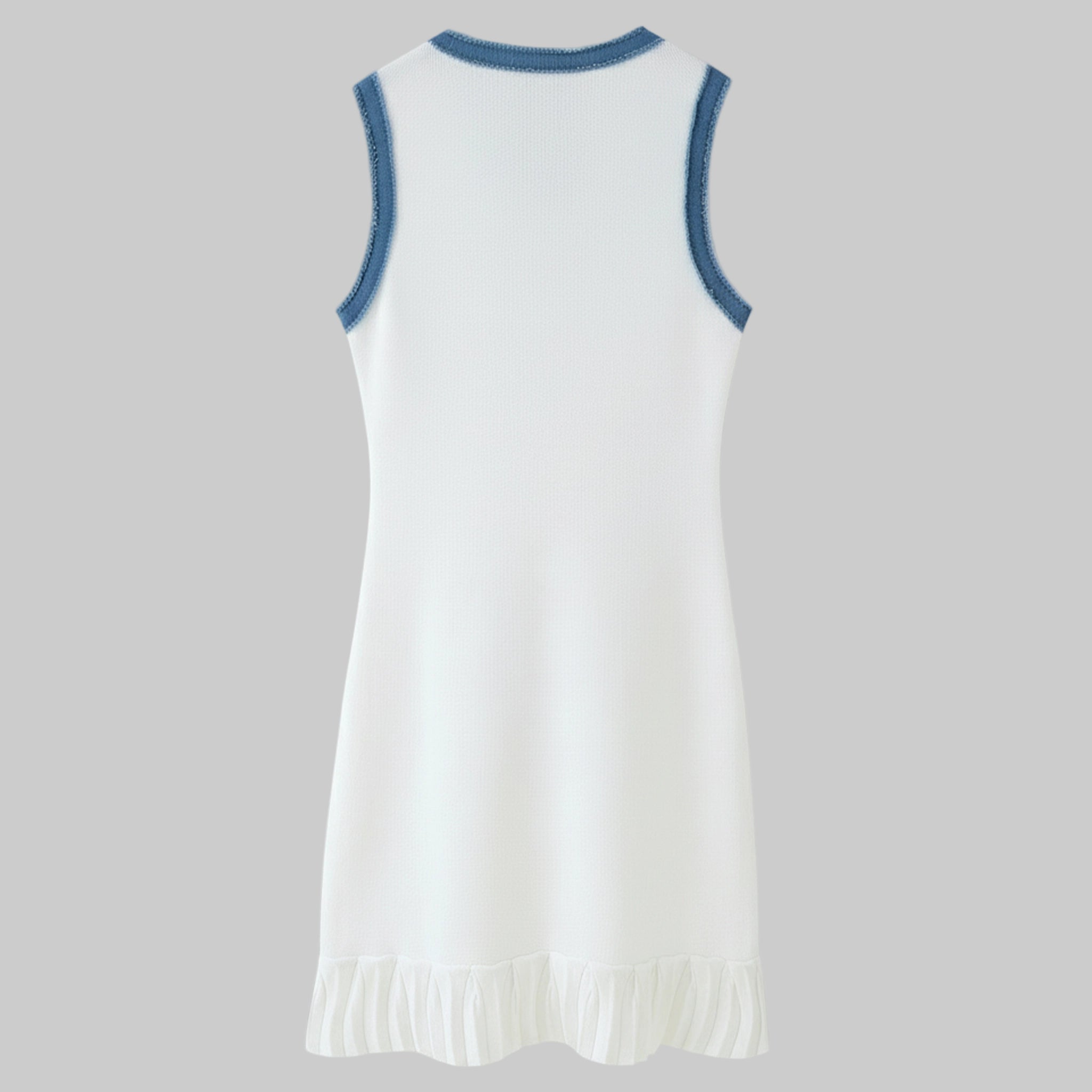White dress with blue trim on a gray background