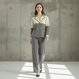 Woman wearing a gray and beige suit on a gray background