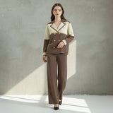 Woman wearing a two-tone suit with a neutral background