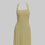 Beige halter neck dress on a light gray background