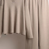 Beige dress on a mannequin against a neutral background