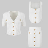 White outfit with gold buttons on a white background