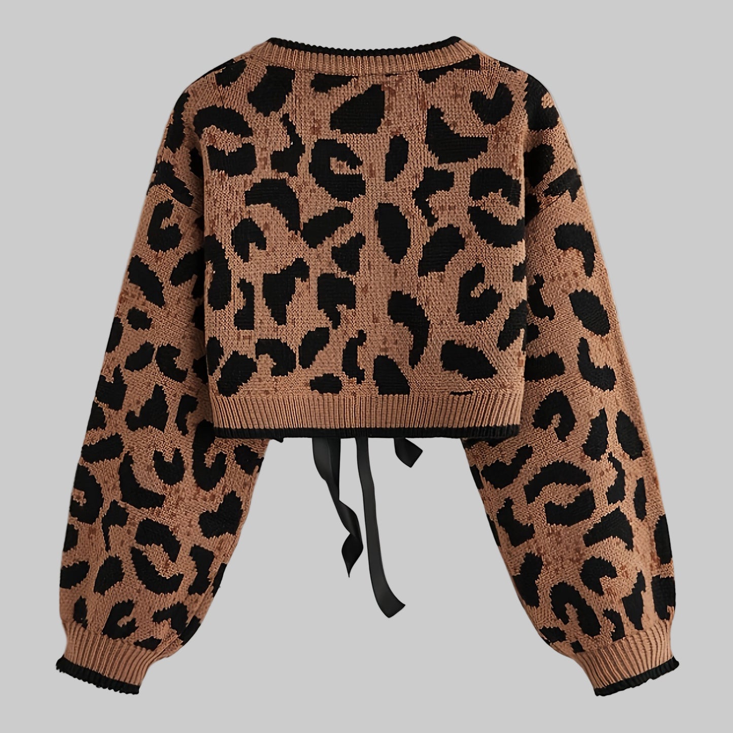 Leopard print sweater with a tie detail on a light gray background