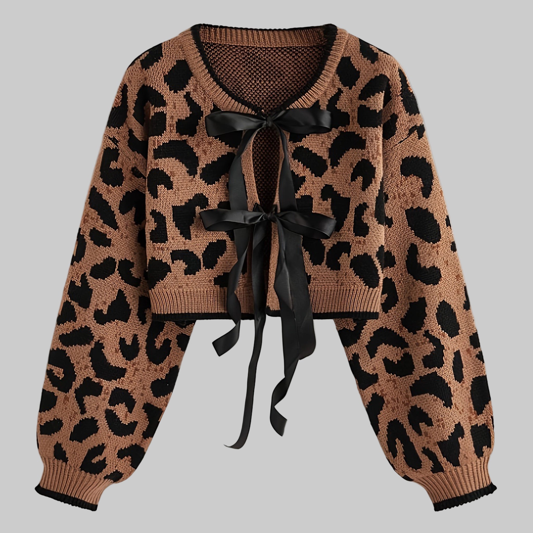 Leopard print cardigan with a black ribbon on a light gray background
