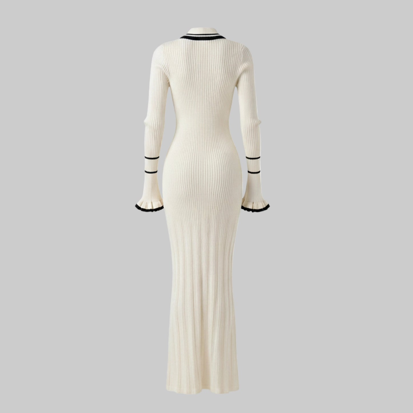 White ribbed dress with black trim on a white background