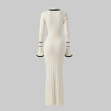 White ribbed dress with black trim on a white background