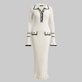 White dress with black accents on a white background