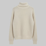 Beige turtleneck sweater on a light gray background