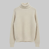 Beige turtleneck sweater on a light gray background