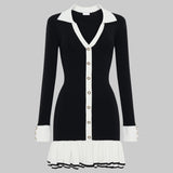 Black and white dress with a V-neckline and pleated skirt on a white background