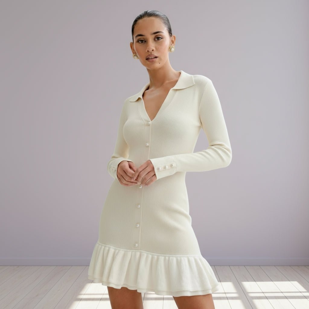 Woman wearing a cream-colored dress with a plain background