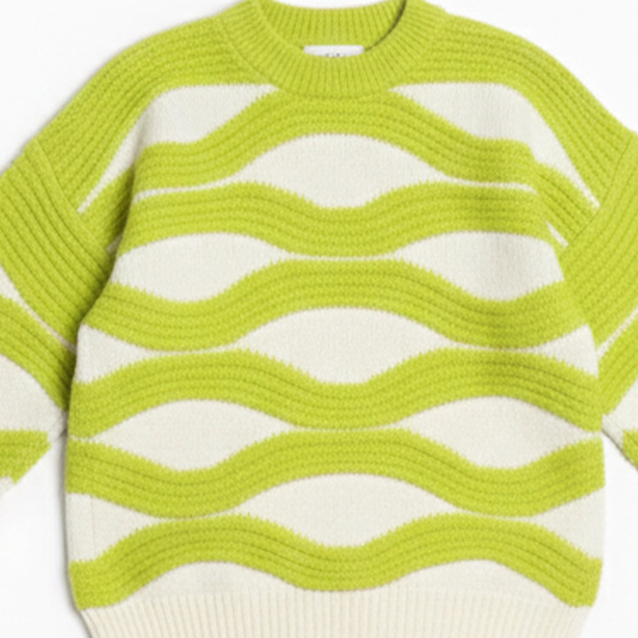 Green and white striped sweater on a white background