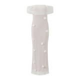 White off-shoulder dress with pearl embellishments on a white background