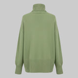 Green sweater with a turtleneck on a white background