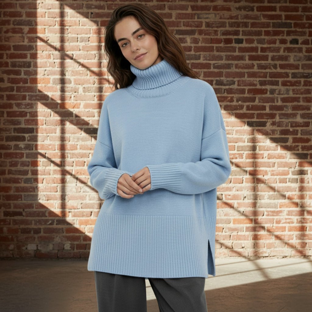 Woman wearing a light blue sweater on a gray background