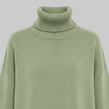 Green turtleneck sweater on a white background