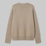 Beige sweater on a light gray background