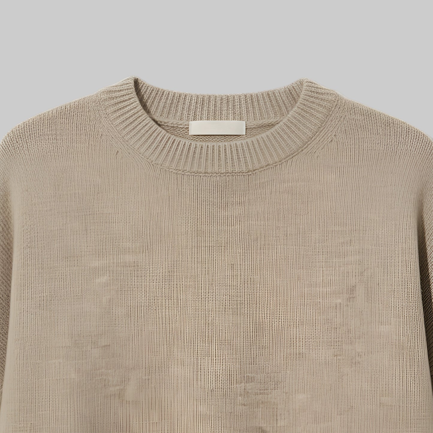 Beige sweater on a light gray background