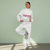 Person wearing a white hoodie with 'Palm Springs' text on a gray background