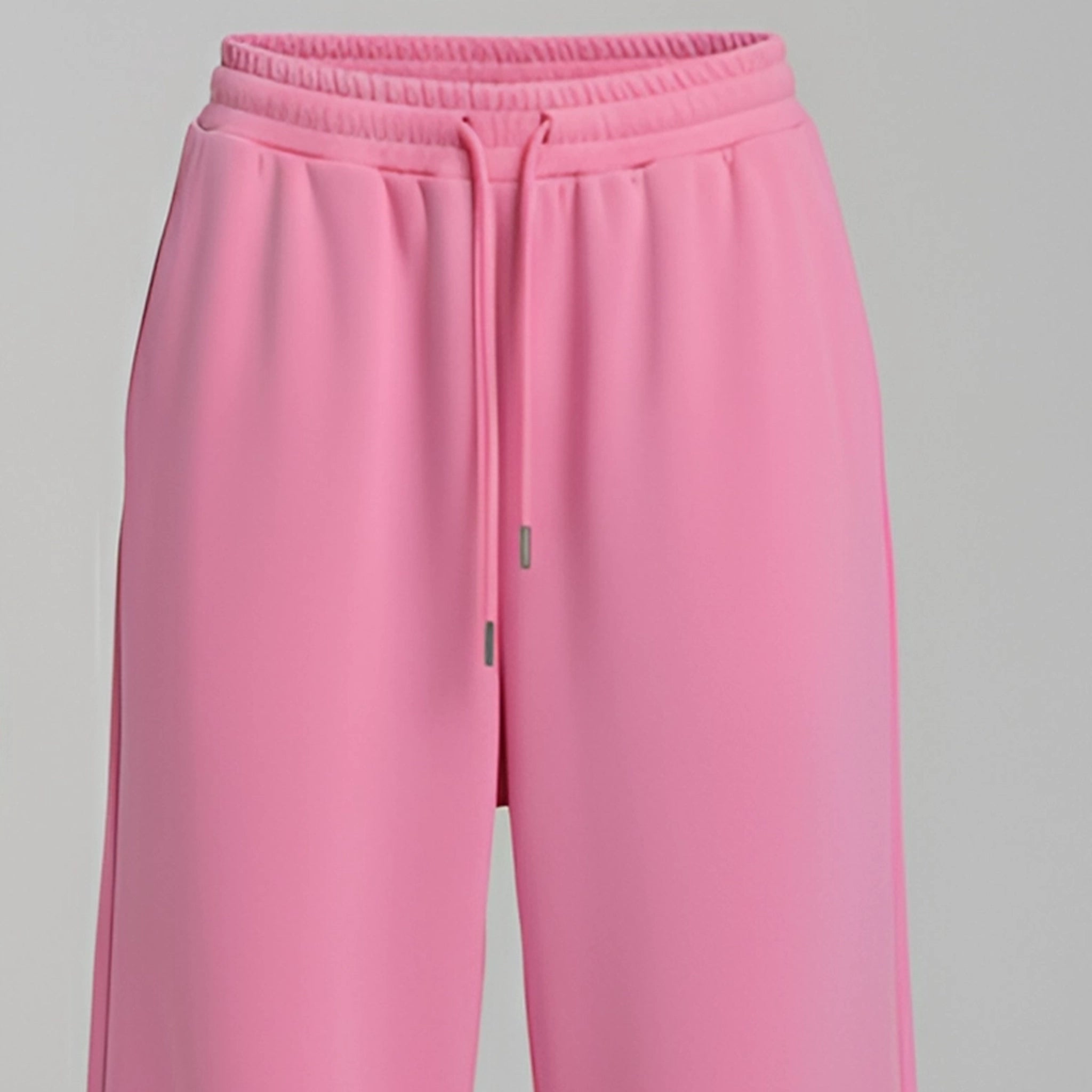 Pink sweatpants on a gray background