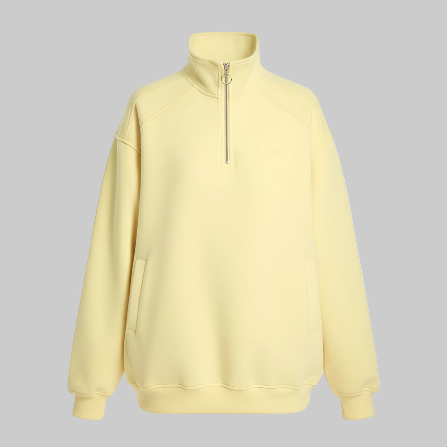 Light yellow half-zip sweatshirt on a white background