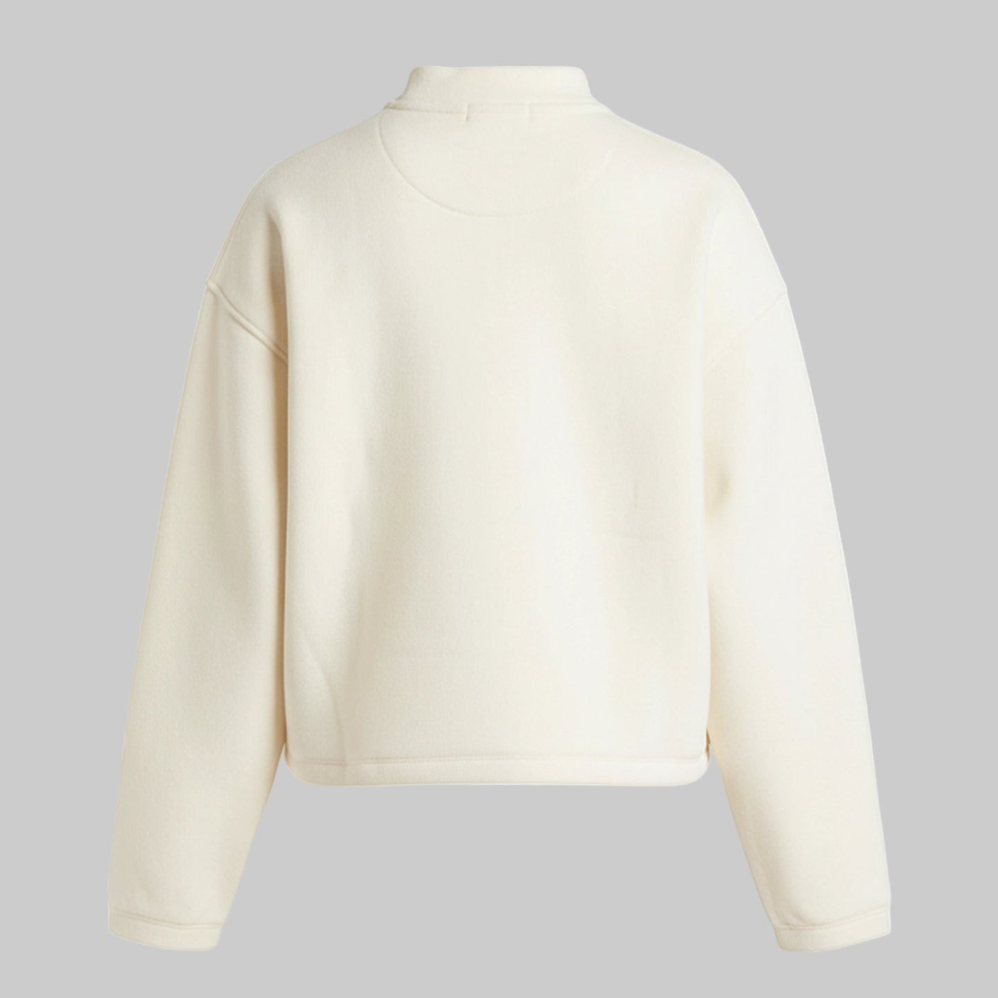 Beige cropped jacket on a gray background