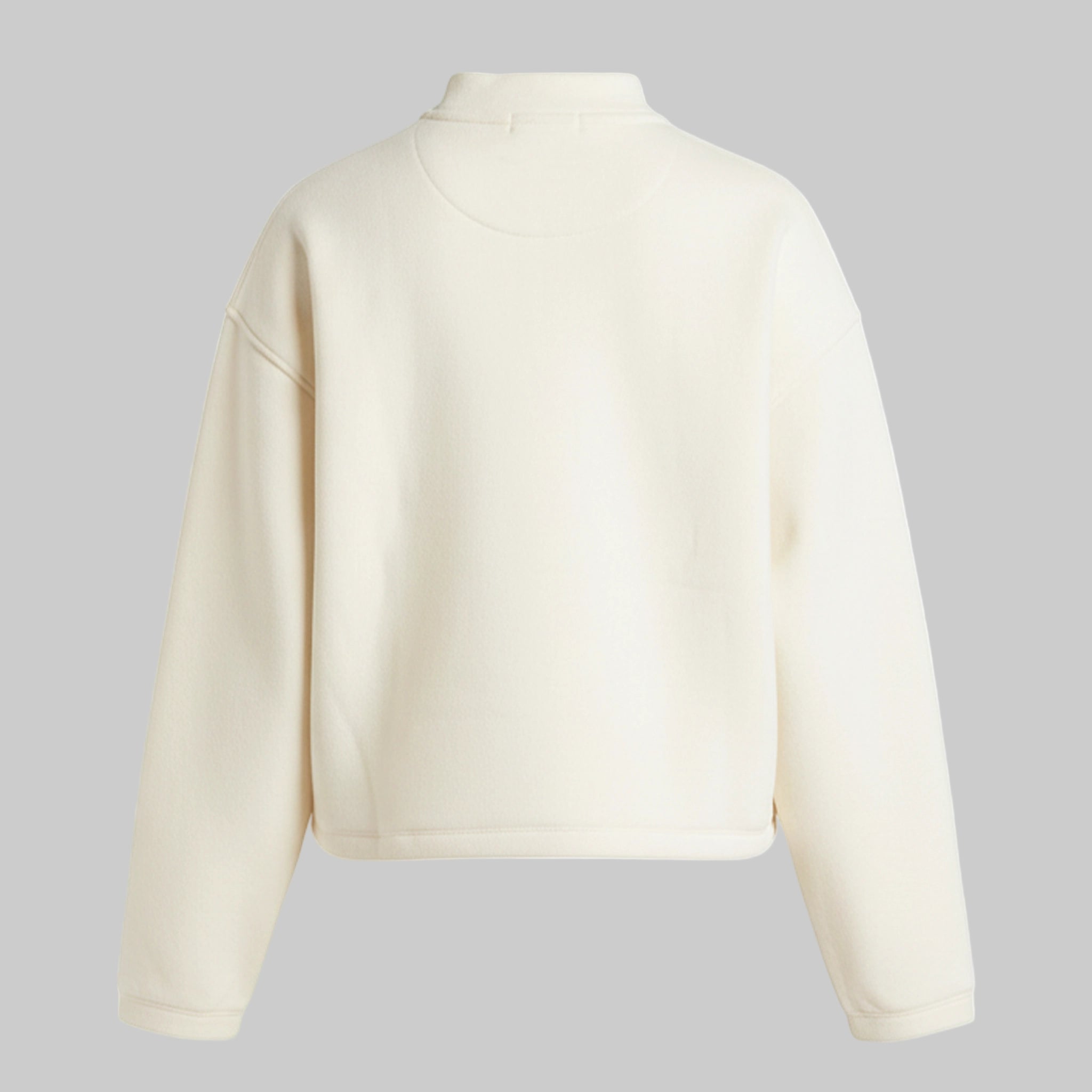 Beige cropped jacket on a gray background