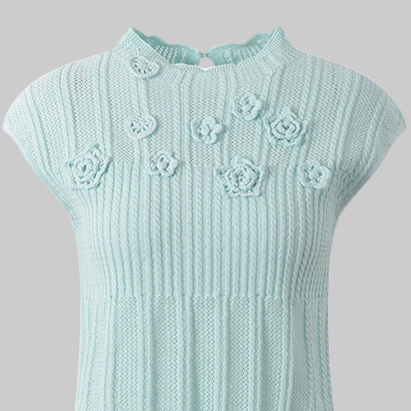 Light blue knitted dress with floral patterns on a white background