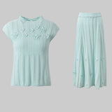 Light blue top and skirt set on a white background