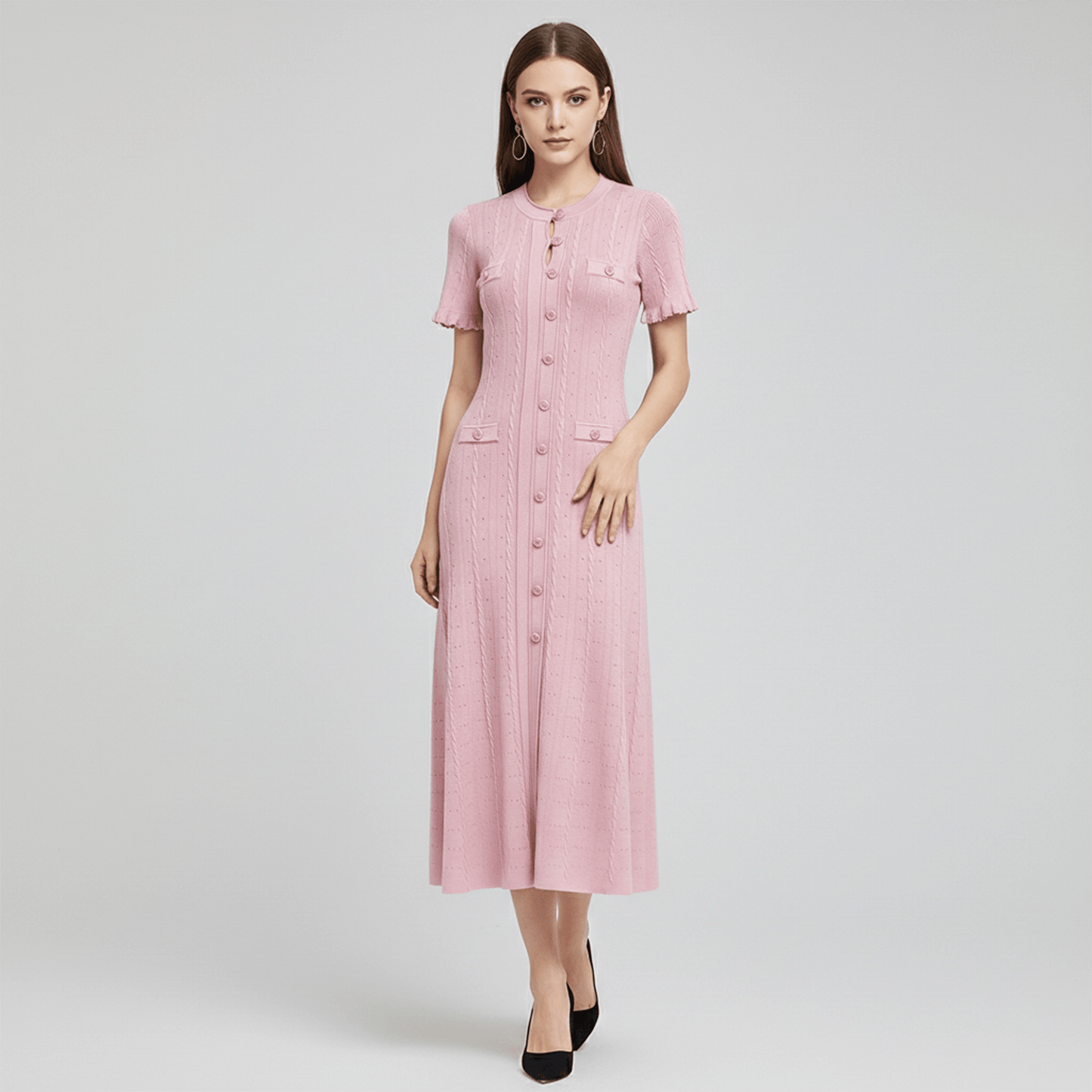 Woman wearing a pink dress on a white background