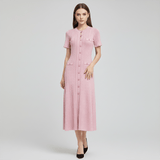 Woman wearing a pink dress on a white background