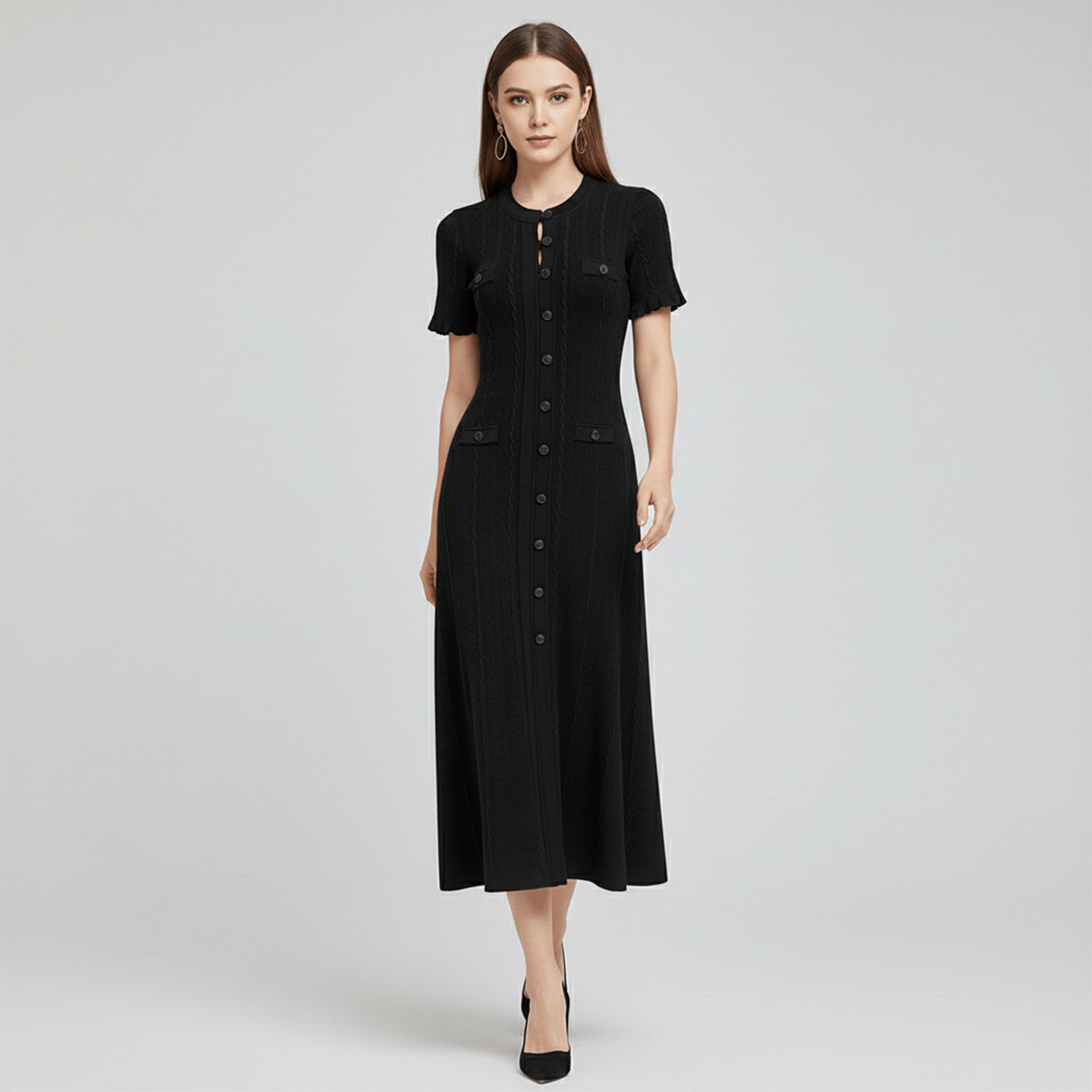 Woman wearing a black dress on a gray background