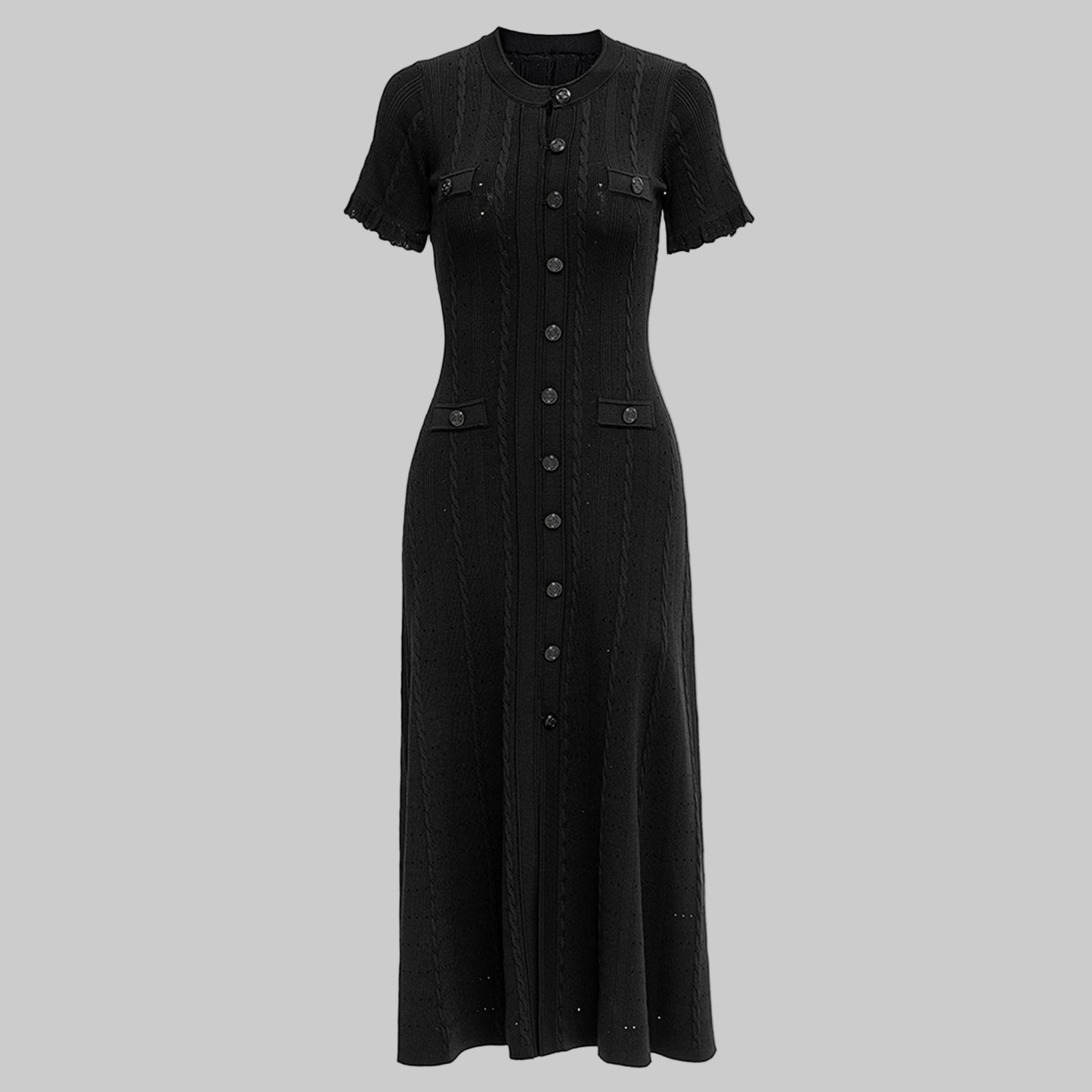 Black dress with buttons on a white background