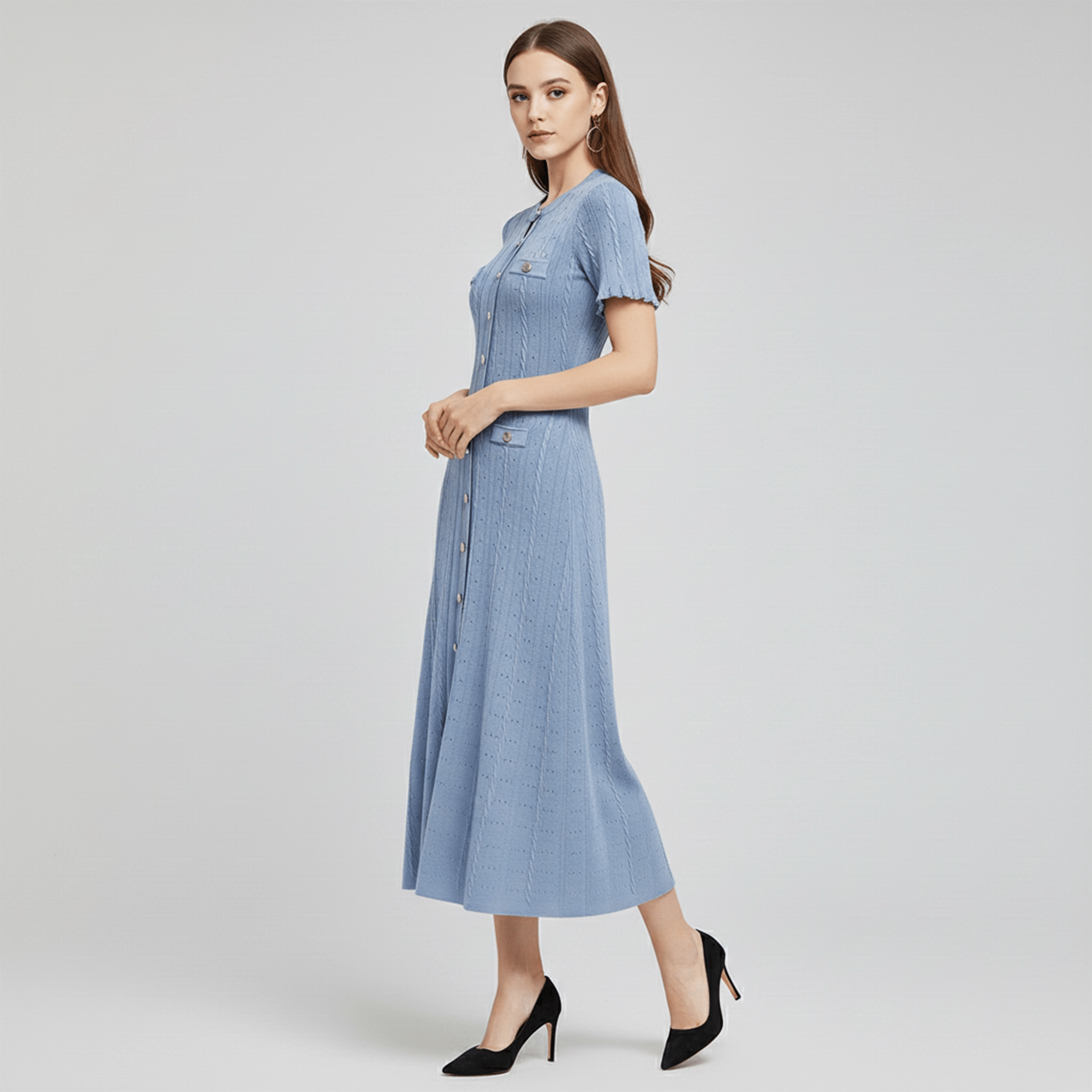 Woman wearing a blue dress on a light gray background