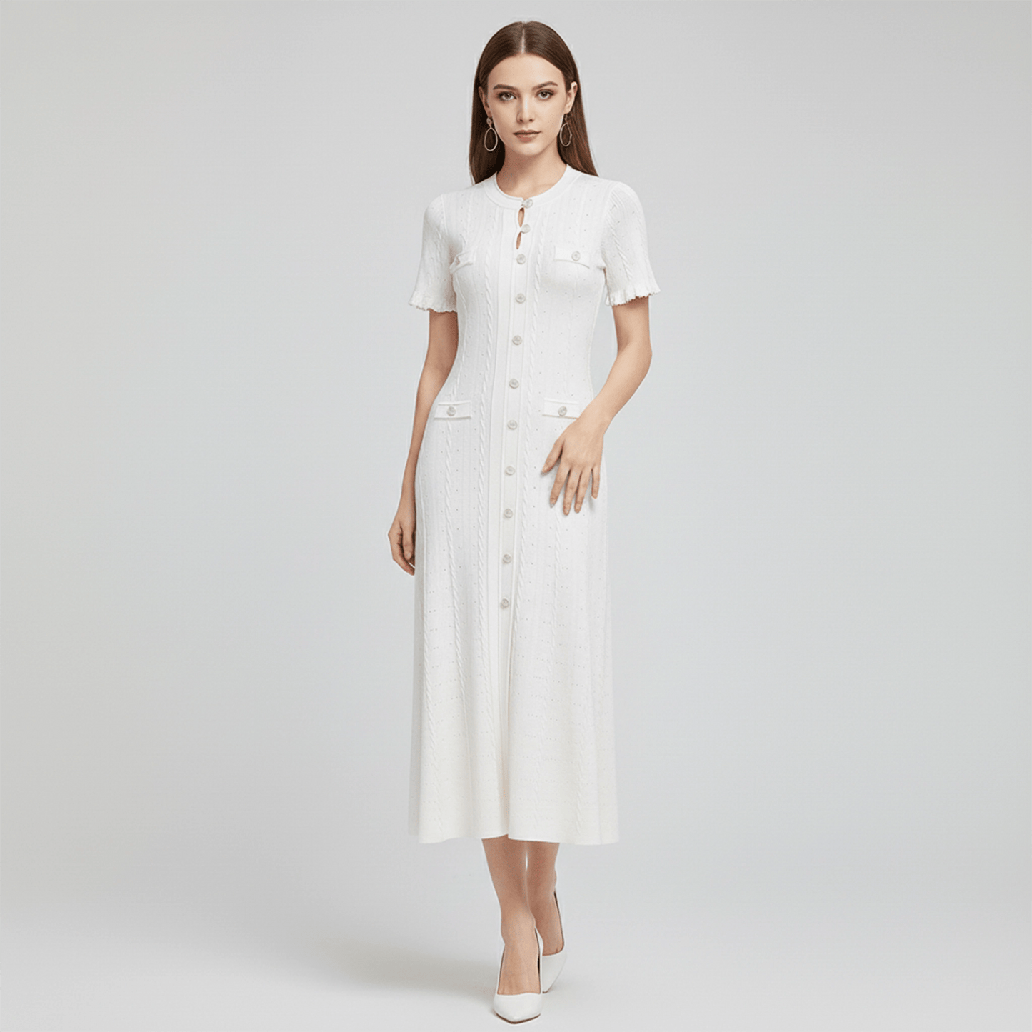 Woman wearing a white dress on a light gray background