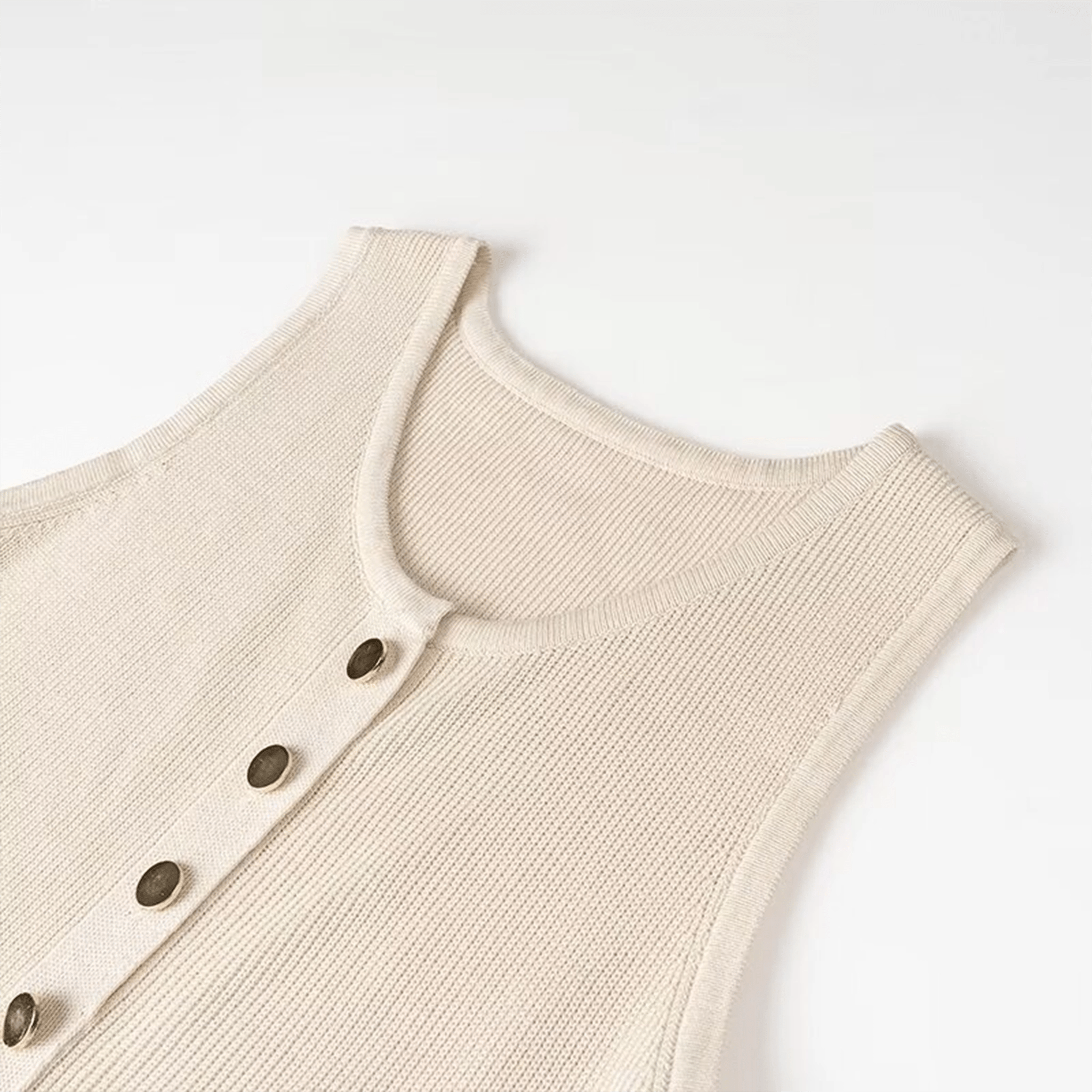 Beige knitted vest with button details on a white background