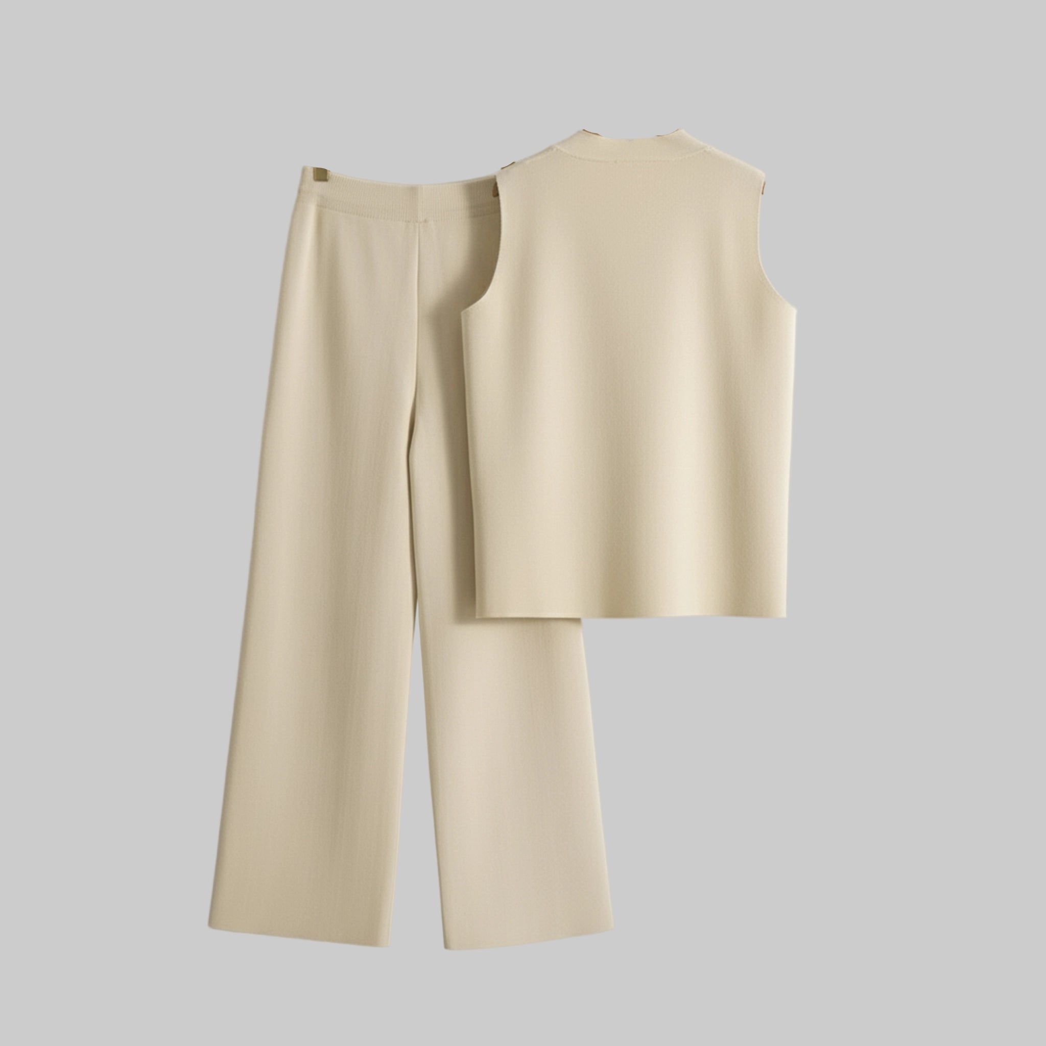 Beige vest and wide-leg pants on hangers against a gray background
