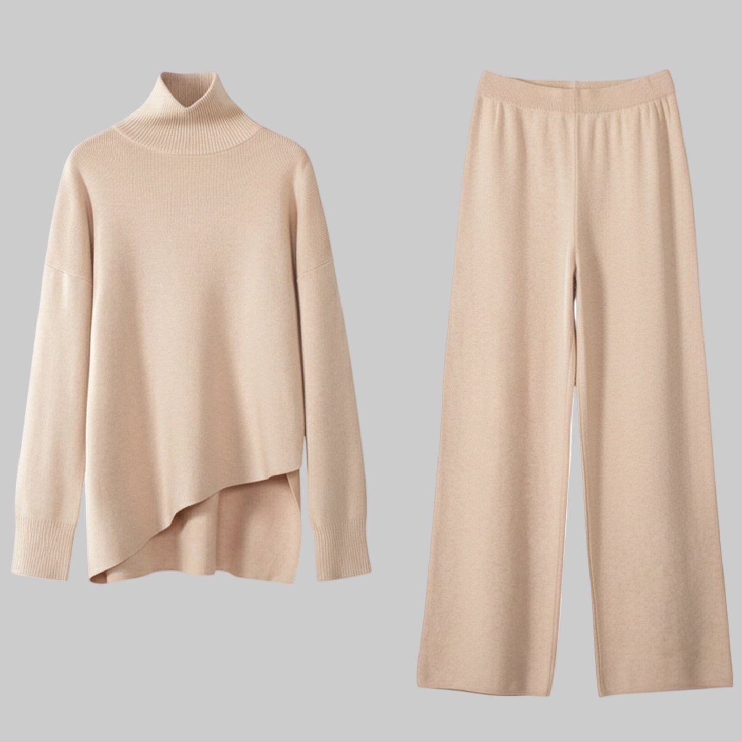 Beige sweater and pants set on a white background