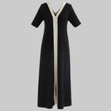 Black dress with a white stripe on a white background